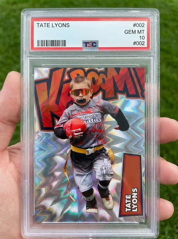 A custom football card held outdoors